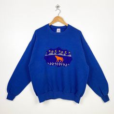 90s Art Wolf Crewneck Sweatshirt Embroidery Logo Blue Color Men's XL - Made in Usa - Materials : Cotton, Polyester  - Tag Reads : XL Kindly see the actual measurements (All measurements were taken lying flat) - Actual size manual measurements * Width (Armpit to armpit) : 25 inches * Length (Shoulder to end of garment) : 27 inches * Sleeve length : 23 inches - Condition : * Vintage condition 8/10 (80%) * Minor stain and defect refer picture - Shipping : * DHL EXPRESS = 3-6 business day arrived * Please PROVIDE your PHONE/CONTACT NUMBER for SHIPPING/DELIVERY purpose DON'T FORGET TO VISIT MY SHOP FOR MORE GREAT STUFF, THANK YOU. Blue Crew Sweater With Embroidered Graphics, Blue Crew Neck Sweater With Embroidered Graphics, Winter Blue Tops With Embroidered Graphics, Blue Tops With Embroidered Graphics For Winter, Blue Embroidered Tops For Winter, Blue Long Sleeve Sweater With Embroidered Graphics, 90s Embroidered Winter Tops, Nike Crewneck Sweatshirt, Art Wolf