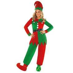 a woman in a green and red christmas elf costume standing with her hands on her hips