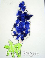 a blue flower on a piece of paper