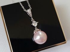 Wedding Light Pink Rosaline Blush Pink Pearl Drop Silver Bridal Pendant Necklace with .925 Sterling Silver Chain. CHAIN is 18 inches (45.7cm) long. PENDANT is about 1.13 inch (2.9cm) long including bail. MATCHING EARRINGS Pic.#7: https://www.etsy.com/listing/618167974/pink-pearl-earrings-blush-pink-pearl?ref=shop_home_active_19 BRIDAL NECKLACES SECTION: https://www.etsy.com/shop/LanaChayka?ref=seller-platform-mcnav§ion_id=11638944 BRIDAL JEWELRY SETS SECTION: https://www.etsy.com/shop/LanaChayka Elegant Pink Pearl Necklace For Anniversary, Elegant Blush Necklace For Gift, Elegant Pink Bridal Necklace For Wedding, Pink Elegant Bridal Necklace, Delicate Pink Pearl Necklace For Wedding, Pink Pearl Pendant Jewelry For Anniversary, Pink Round Jewelry For Wedding, Round Pink Bridal Necklace For Wedding, Pink Pearl Pendant Jewelry For Wedding