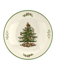 a christmas tree on a white plate with green trim