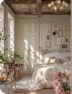 a bedroom with white walls and flooring has flowers in vases on the bed