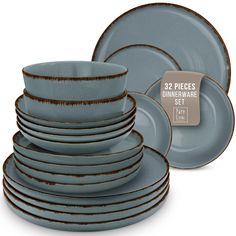 the dinnerware set is blue and has brown trimmings on it, along with a tag that says 32 pieces