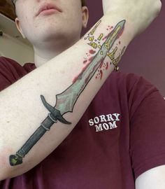 a man with a knife tattoo on his arm