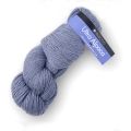 a skein of yarn on a white background with a blue tag in the middle