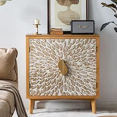 a living room with a couch, chair and sideboard that has an animal print design on it