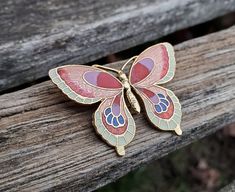 "This vintage, cloisonne butterfly pin is cute! The metal is a gold color and the butterfly has multiple colors: ivory, two shades of coral, lavender, red, and cobalt blue. This would be the perfect gift for any occasion. Size: 1.25\" x 1.65\" Condition: Excellent Maker's Mark: None This model is retired and is no longer in production. All jewelry items come in a gift box. #A1" Butterfly-shaped Enamel Pin Gift, Butterfly Shaped Enamel Pin For Gifts, Butterfly Shaped Enamel Pin Gift, Butterfly Enamel Pin Gift, Orchid Necklace, Cloisonne Earrings, Lotus Earrings, Butterfly Pin, Bridesmaid Wedding