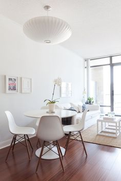 a white table and chairs in a room