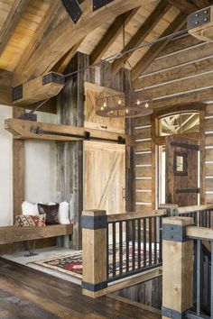 an open wooden door in the middle of a room with wood flooring and walls