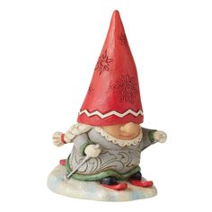 a small figurine with a red hat on it's head and legs