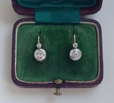 Antique Austro-Hungarian drop earrings with old cut diamond gemstones. In 14K yellow gold and silver. Solid, leverback. With a Hungarian hallmark that was used between 1867 and 1937. Two old cut diamonds, 0.153 x0.09 inches (3.90 x 2.31 mm) ca. 0.22 carat and 0.149. x 0.086 inches (3.80 x 2.19 mm) ca. 0.2 carat Color: G/H (Wesselton) Clarity: VS Fluorescence: 1 stone faint blue Weight: 0.42 carat Two small old eight cut diamonds, each 0.051 inches (2x1.3 mm), in total 0.02 carat Color: I/J (Crys Austro Hungarian, Snake Earrings, Gold Snake, Akoya Pearls, Diamonds And Gold, Art Deco Diamond, Girls Earrings, Antique Earrings, Gold Drop Earrings