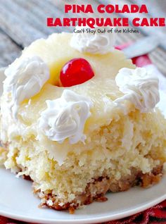 a piece of pineapple cake on a white plate with a cherry in the middle