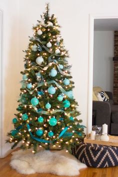 a christmas tree with blue and green ornaments