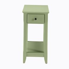 a small green table with a drawer on it