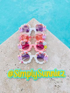 PLEASE NOTE: FOR PARTY FAVORS - Names can be added, or you can purchase as is :) ☀️ Cute customized sunglasses for your little ones! These sunnies are perfect for either boys or girls and they're one size only. (They should fit little ones of ages 5 months-9 years)  ☀️Light-weight design, comfortable to wear ☀️ They are completely customizable, can include the name or any phrase you'd like ☀️ All sunnies come with a sunglass pouch for storage ‼️ Disclaimer: PLEASE MAKE SURE TO SUPERVISE YOUR LITTLE ONES WHILE THEY USE THEIR SUNNIES DUE TO SMALL PARTS WHICH CAN BE CHOKING HAZARD.  📦Items are made to order and can take up to 5 business days to ship.  ☀️No returns or exchanges due to personalization, but if there is a problem please contact me!  💛 Show some love! Follow me on Instagram @Sim Customized Sunglasses, Sunglass Pouch, Ballet Party, Ballet Gift, Cute Sunglasses, Tiny Dancer, Kids Sunglasses, 5 Months, Photo Look