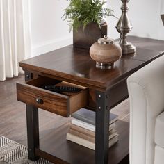 Classic and industrial elements meet to make up the iNSPIRE Q iNSPIRE Q dark wood finish end table with built-in Outlets with USB charging ports. With a rich and smooth wood finish and obvious wood grain pattern, this table is perfect for the cabin's or lake house's living space. A durable, black metal frame holds this piece together and gives the table a slight modern appearance. The single drawer provides secure storage for everyday essentials, while the bottom shelf space offers up space to s Wood Grain Pattern, Neutral Living Room, Black Metal Frame, Bottom Shelf, Cocktail Table, Work Surface, Top Design, Table Set, Everyday Essentials