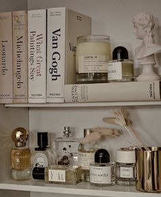 shelves filled with different types of skin care products and perfume bottles on top of each other