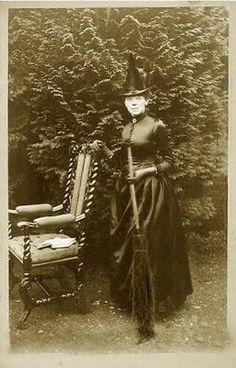 an old photo of a woman with a chair