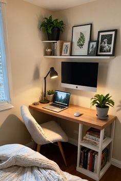 a desk with a laptop computer on top of it next to a book shelf filled with books