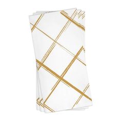 three white and gold napkins on a white background