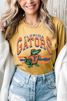 FLORIDA GATORS,FOOTBALL UNISEX SHORT SLEEVE,GRAPHIC TEE,GRAPHIC TSHIRTS,TSHIRTS,TEES100%COTTON,HEATHER(52%COTTON,48%POLY),ATH.HEATHER,BLACK HEATHER(90%COTTON,573%POLY)NICARAGUAMade In: Nicaragua Florida Gators Football, Gators Football, Essential Oil Accessories, Plus Swimwear, Florida Gators, Skirted Swimwear, Unisex Shorts, Heather Black, Nicaragua