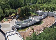 an aerial view of a building surrounded by trees