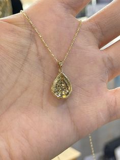 "Beautiful Pear Shape Diamond Necklace set in yellow gold. The diamonds are clear and very sparkling. Elegant and classy shape necklace. It's a nice size pendant, great to wear for any occasion. The diamond cut 14K Yellow Gold Chain has a nice sparkle to it and compliments the pendant perfectly. The chain is solid so it is strong. 18\" chain, let us know if you need a different length chain. Pendant length measures 22mm. The pear shape measures 16.2x12.5mm. Genuine Round Brilliant Cut Diamonds t Luxury Pear-shaped Yellow Gold Diamond Necklace, Fine Jewelry 14k Gold Pear-shaped Diamond Necklace, Yellow Gold Drop Necklace With Prong Setting, 14k Gold Pear-shaped Diamond Necklace, Yellow Gold Teardrop Necklace With Rose Cut Diamonds, Luxury Pear-shaped Yellow Gold Drop Necklace, Pear-shaped Diamond Necklace In 14k Gold, Pear-shaped 14k Gold Diamond Necklace, Elegant Gold Diamond Necklace With Pear-shaped Pendant