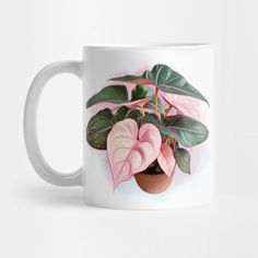 a white coffee mug with pink and green leaves