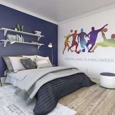 a bed room with a neatly made bed and a mural on the wall