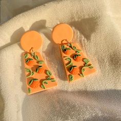 #earrings #fruit #clay #handmade #smallbusinessowner #etsy #etsyshop #colorful #polymerclayjewelry #polymerclayearrings #aesthetic #trendy #danishdesign #danish #sunkissed #jewelry #teenager #outfits #unique #tiktok #instagram #cheap #affordable #badbitchenergy #grapes #cherry #orange #strawberry #californiafashion #chicago #earringstyle #dangle #earringsforsale #earringsoftheday #earringsforwomen #aesthetic #tiktoktrend #cleangirlaesthetic #coquette #vintageinspired #dreamy #summerjewelry Orange Earrings, Teenager Outfits, Handmade Clay, Rose Earrings, Summer Jewelry