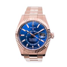 Description Guaranteed Authentic Men's Rolex Sky-Dweller with a 42mm 18K rose gold case and a Blue Index dial. This fine timepiece features an 18K rose gold Oyster bracelet, fluted bezel, date indicator, and a rotating disc with a second time-zone. This watch is unworn with tags and its box. It comes with a Five Year Warranty through Rolex (warranty starts from the original purchase date), a Rolex box, instructions, and certified retail appraisal from Da Vinci Fine Jewelry. Details BRAND Rolex C Classic Blue Watch With Day-date Display, Blue Luxury Automatic Diamond Watch, Luxury Rose Gold Watch With Day-date Display, Blue Watch Accessories With Day-date Display, Men's Rolex, Swiss Luxury Watches, Swiss Luxury, Sky Dweller, Jewelry Details