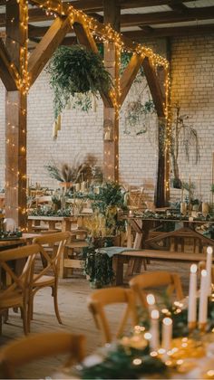 Rustic wedding reception with wooden tables and chairs, surrounded by greenery and warm string lights.