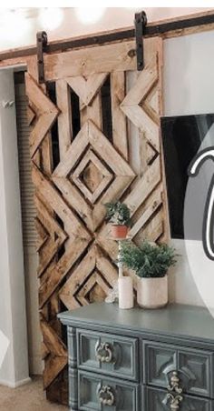 an old dresser has been transformed into a decorative piece with the letter t on it