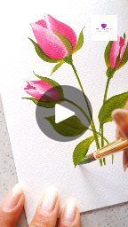 a person is drawing flowers on paper with a pencil and watercolor pen in front of them