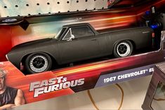 a toy car is on display in a box