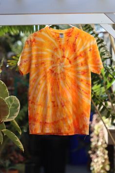 This awesome shirt started out solid yellow. It was swirled, bleached, then dyed using the ice dye then low water immersion processes.  Four different shades of orange dye plus the two shades from the original and bleached portions of the shirt make this a unique and refreshing shirt to wear. Tie Dye Shirt Outfit, Bleach Tie Dye Yellow Shirt, Tye Dye Clothes, Cheap Tie-dye T-shirt For Fall, Orange And Black Tie Dye, Tie Dye Orange Shirt, Blue And Orange Tie Dye, Persona Ideas, Riverside Cottage