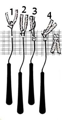 four black and white objects are in the shape of long sticks with ribbons attached to them