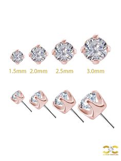 four pairs of stud earrings with cubics on each side and one diamond in the middle