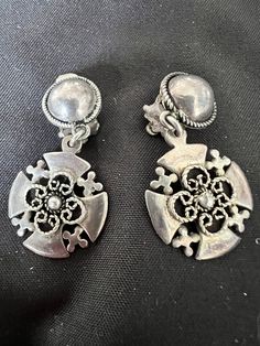 Vintage Sterling Silver Jerusalem Cross Dangle Drop Earrings. Signed on back. Some toning from age. Measures approx 1 1/2" X 3/4" Weight is approx 10 grams Unique Clip-on Drop Earrings, Unique Silver Dangle Clip-on Earrings, Ornate Silver Clip-on Earrings For Formal Occasions, Ornate Metal Dangle Clip-on Earrings, Antique Silver Dangle Clip-on Earrings, Ornate Clip-on Drop Earrings, Vintage Sterling Silver Drop Clip-on Earrings, Vintage Silver Nickel Free Clip-on Earrings, Unique Silver Clip-on Earrings