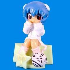 a small figurine sitting on top of a table