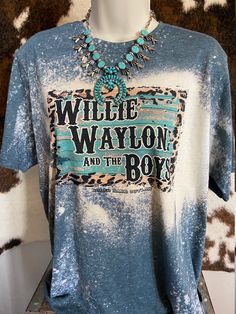 Saddle up and show off your love for country life with our Willie, Waylon and The Boys Graphic Tee! This unisex jersey short-sleeve tee is the perfect addition to your wardrobe. Made from a super soft cotton blend, it feels like a well-loved favorite from the moment you put it on.  With its excellent quality print, this tee is sure to catch the eye of fellow rodeo enthusiasts and fans of the Western lifestyle. Whether you're hitting the ranch or heading to a country concert, this tee will have you looking stylish and feeling comfortable all day long. Our Willie, Waylon, and The Boys Graphic Tee is proudly custom-made at our facility in the USA, ensuring top-notch quality. The tear-away tag adds an extra level of convenience, while the light fabric guarantees breathability even during those Graphic Print Crew Neck T-shirt For Country Concerts, Short Sleeve T-shirt For Country Events, Graphic Tee For Country Events With Short Sleeves, Short Sleeve Graphic Tee For Country Events, Graphic Print Crew Neck T-shirt For Country Events, Summer Graphic Print T-shirt For Country Events, Crew Neck T-shirt For Country Concerts And Festivals, Crew Neck T-shirt For Country Concerts, Country Style Short Sleeve Tops With Letter Print