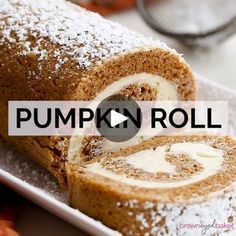 pumpkin roll on a plate with powdered sugar