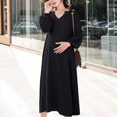 This stylish maternity dress is designed with long sleeves and a flattering V-neck. Made from cozy knitted fabric, it offers comfort and stretch for a growing baby bump. Perfect for any occasion, it's a must-have for expectant mothers. Stylish Maternity Dress, Knitted Dresses, Stylish Maternity, 2nd Baby, Baby Bump, Maternity Dress, Mom Outfits, Mom Blogs, Unisex Baby