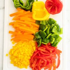 the vegetables are cut up and ready to be put in the oven or used as garnishes