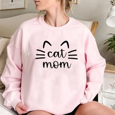 Channel Your Inner Cat Mom - A Sweatshirt that Speaks Volumes of Your Love and Warmth Towards Your Baby Cat(s) Size chart: Cute Cotton Sweatshirt With Cat Design, Pink Long Sleeve Tops With Cat Design, Pink Long Sleeve Top With Cat Design, Casual Cotton Sweatshirt With Cat Design, Casual Cotton Sweatshirt With Cat Print, Casual Pink Sweatshirt For Mother's Day, Mother's Day Casual Long Sleeve Sweatshirt, Casual Long Sleeve Sweatshirt For Mother's Day, Casual Cat Print Sweatshirt In Relaxed Fit