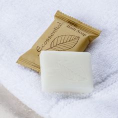 a bar of soap sitting on top of a white towel