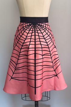 Live your most stylishly spooky life in this fab skirt! It's custom-printed with vintage inspired spiderwebs to complement the embroidery on the matching romper, plus a button front and pockets - how Glamour Ghoul is that? Imported. Pink Fitted Halloween Skirt, Witchy Fitted Skirt For Halloween, Glamour Ghoul, A Button, Coral Pink, Live For Yourself, Vintage Inspired, Custom Print, Coral