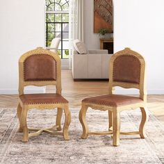 two wooden chairs sitting on top of a rug