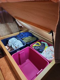 an open drawer filled with clothes and other items