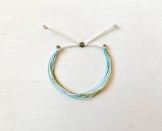 This fun bracelet is waterproof and great for anyone who is often doing outdoor activities. It would make a nice gift. Stack it with other bracelets, or wear it by itself! It is perfect for everyday wear! ∙ ∙ ∙ ∙ ∙ ∙ ∙ ∙ ∙ ∙ ∙ ∙ ◆ PLEASE NOTE ◆ When you first receive this bracelet it may be slightly sticky, which may make it more difficult to adjust. The stickiness does not last. After a day or two of wearing the stickiness will fade and it will be much easier to adjust. It will still be waterpr White Nylon Cord Friendship Bracelets As Gift, White Friendship Bracelets With Sliding Knot In Waxed Cord, Adjustable White Nylon Cord Friendship Bracelets, Adjustable White Friendship Bracelets, White Nylon Cord Bracelets For Beach, White Friendship Bracelet With Sliding Knot And Waxed Cord, White Resizable Braided Bracelets With Waxed Cord, Adjustable White Waxed Cord Friendship Bracelets, Everyday White Waxed Cord Bracelets